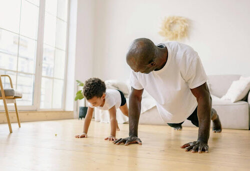 Man and his son create an exercise routine together.